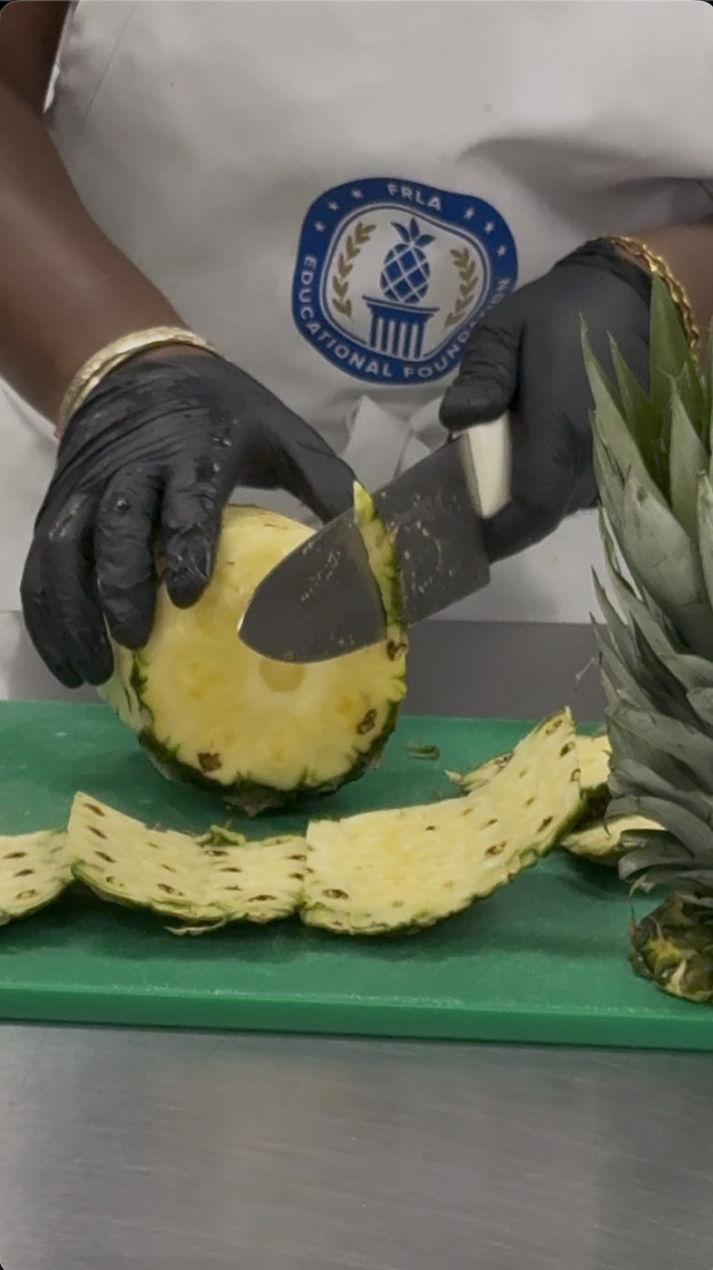 Breaking down a whole pineapple for the salsa.