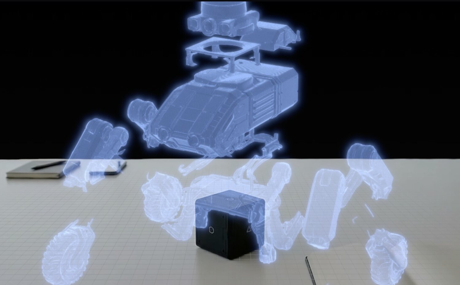 A 3D hologram exploded above a small cube — spatial accessories that add interaction and tracking.